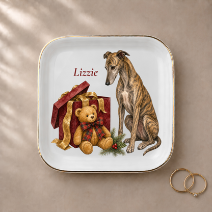 Greyhound jewelry dish styled with gold rings and a personalized name