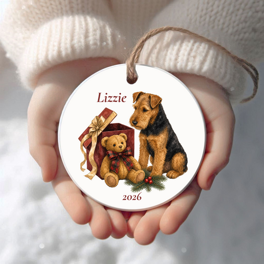 Personalized Welsh Terrier Christmas ornament held in cupped hands