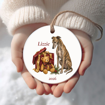 Personalized Greyhound (Brindle) Christmas ornament held in cupped hands