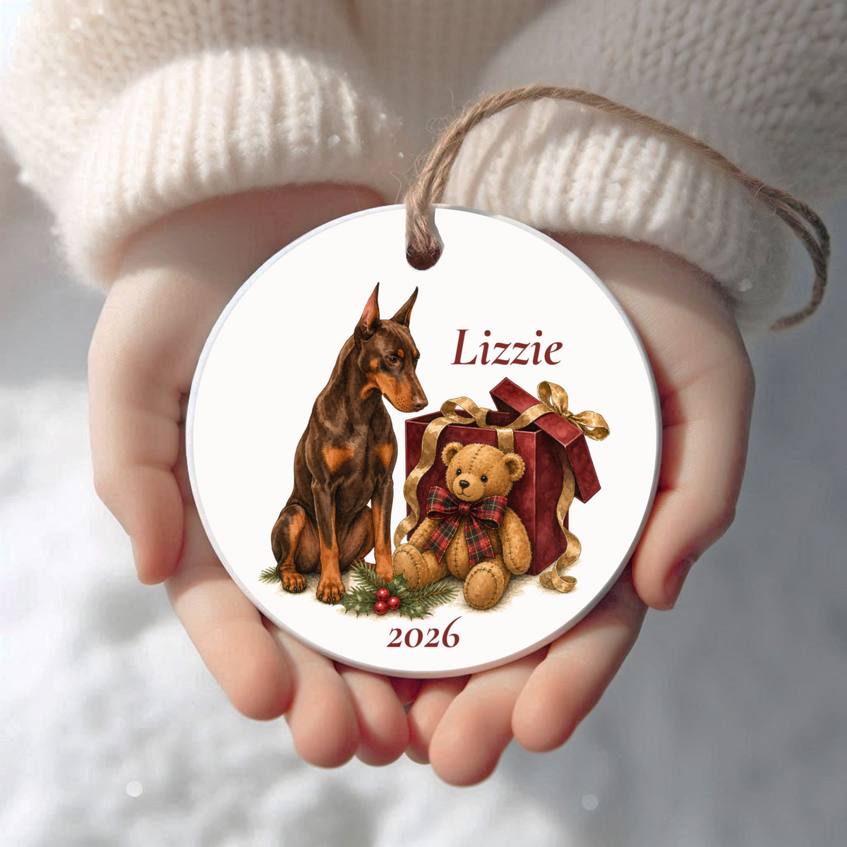Personalized Doberman Pinscher (Red) Bear Necessities Christmas ornament held in cupped hands