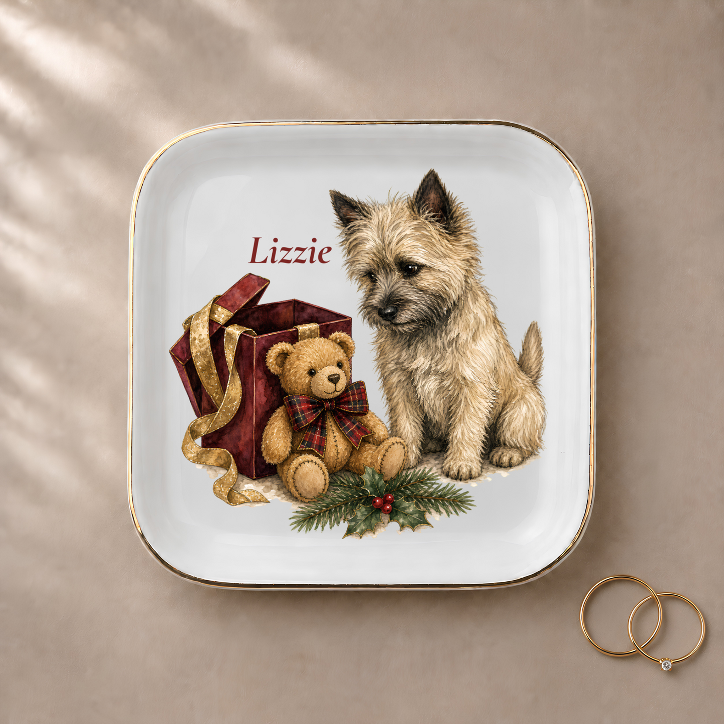 Cairn Terrier jewelry dish styled with gold rings and a personalized name