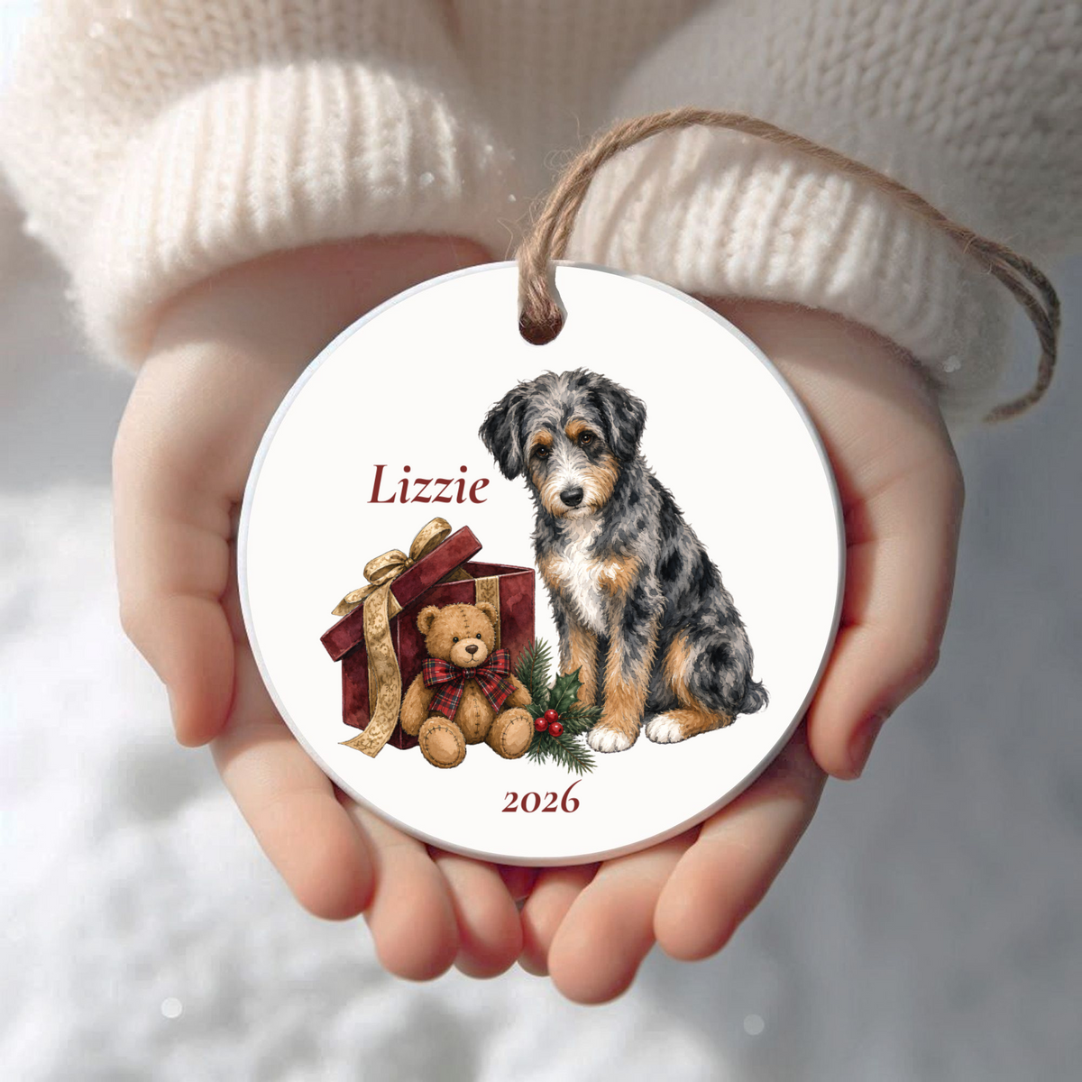 Personalized Aussiedoodle (Blue Merle) Bear Necessities Christmas ornament held in cupped hands