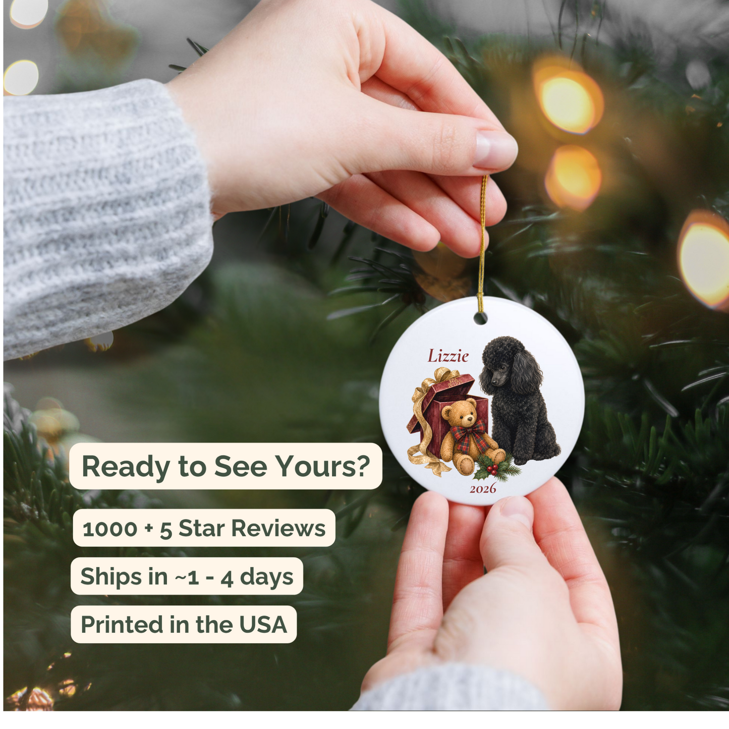 Hand holding a personalized Miniature Poodle (Black) ceramic ornament beside a Christmas tree