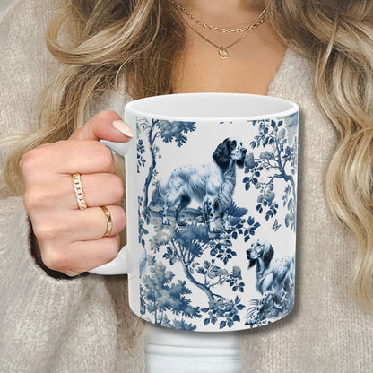 Blue toile English Setter coffee cup against a cozy beige sweater