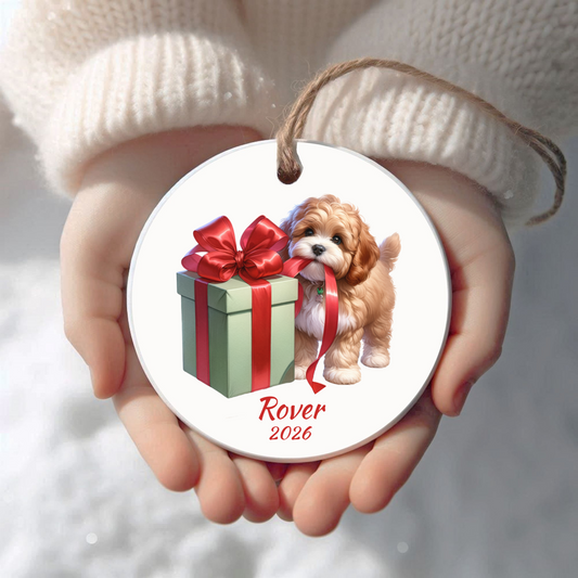 Personalized Cavapoo Christmas ornament held in cupped hands