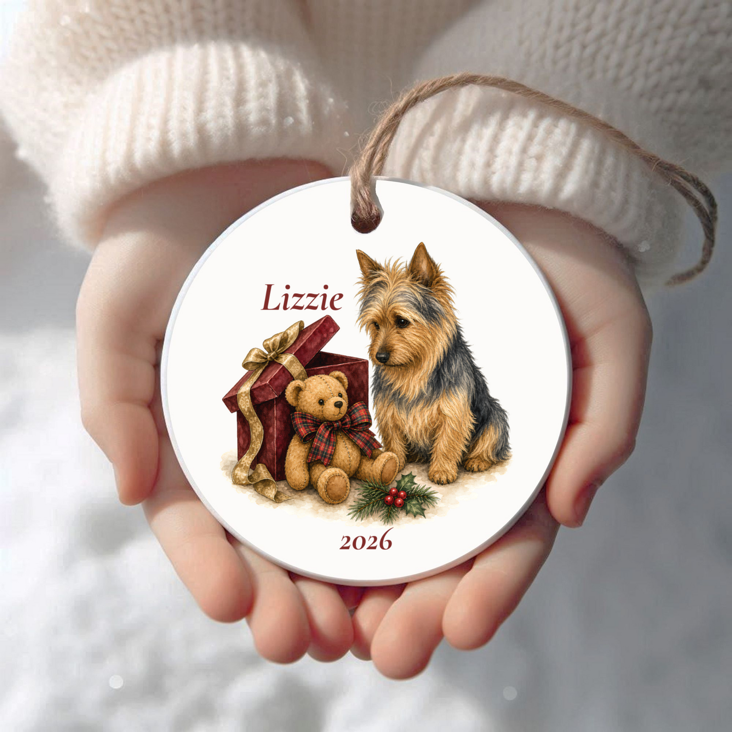 Personalized Australian Terrier Christmas ornament held in cupped hands