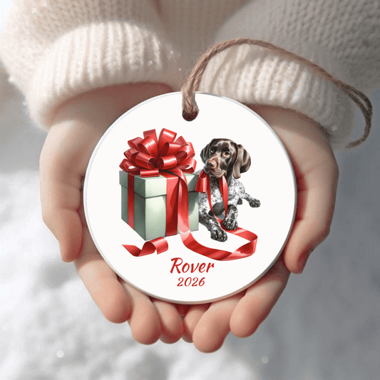 Personalized German Shorthaired Pointer Christmas ornament held in cupped hands