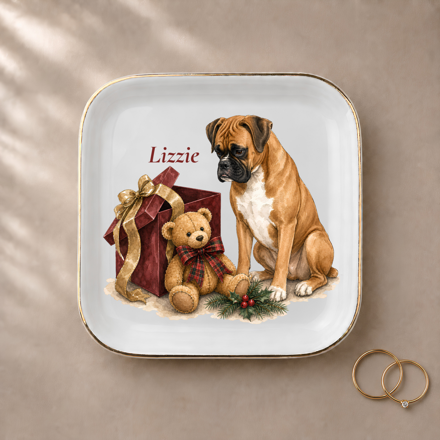 Boxer jewelry dish styled with gold rings and a personalized name