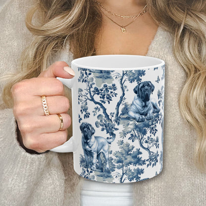 Blue toile English Mastiff coffee cup against a cozy beige sweater