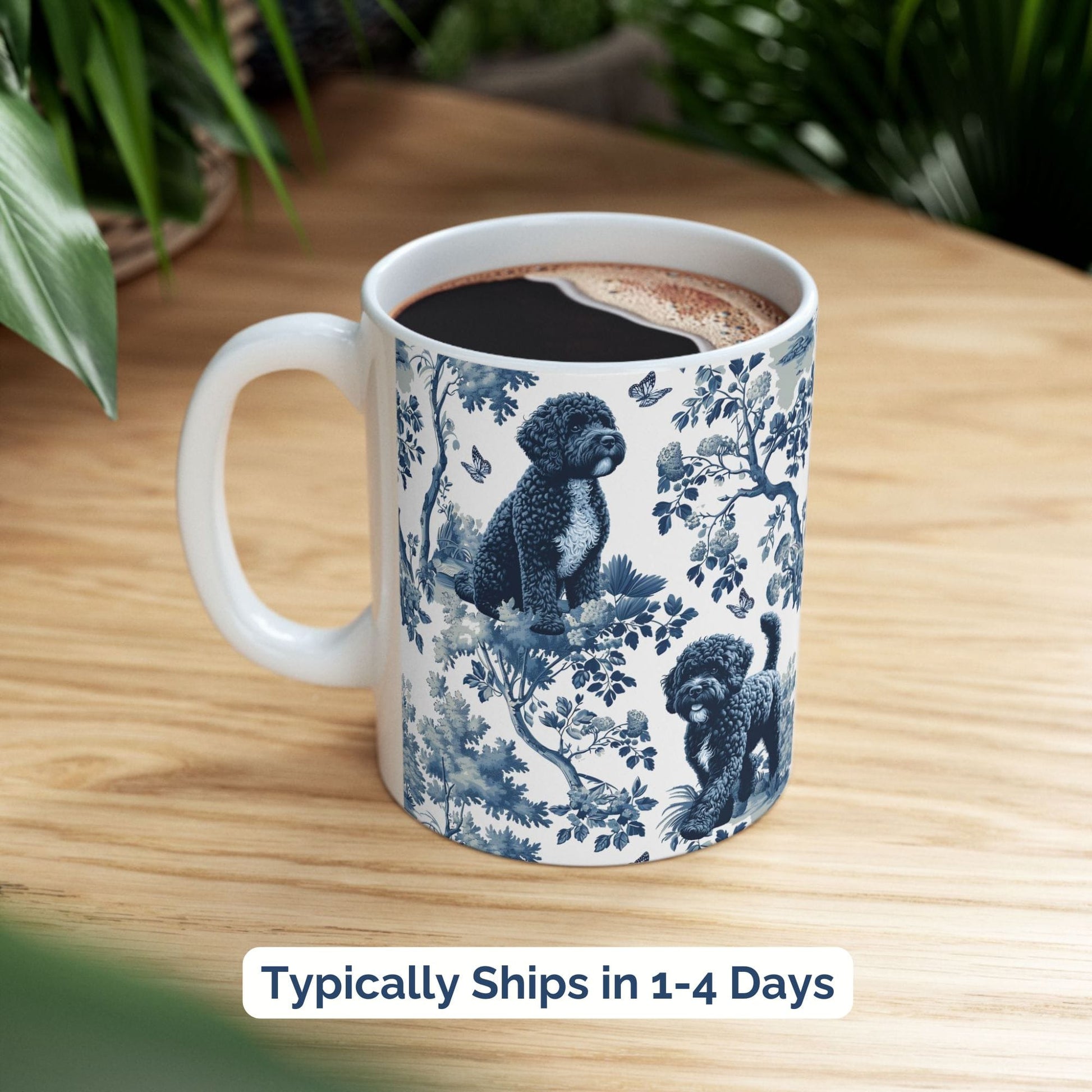 Blue toile Portuguese Water Dog coffee cup styled on a wooden board in a festive setting